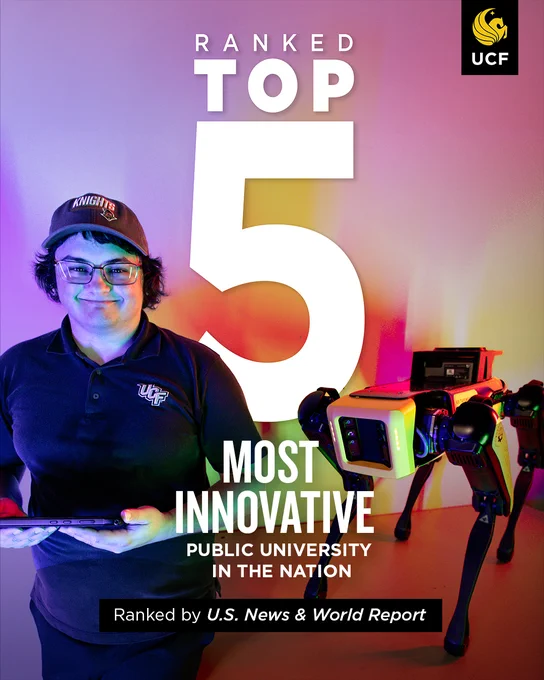 Person in UCF apparel standing next to a robotic dog, under a sign stating 'Ranked Top 5 Most Innovative Public University in the Nation by U.S. News & World Report.' Purple and pink lighting in the background.