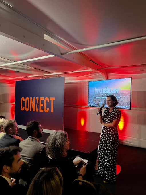 Connect partner welcoming audience to leaders speech watch party