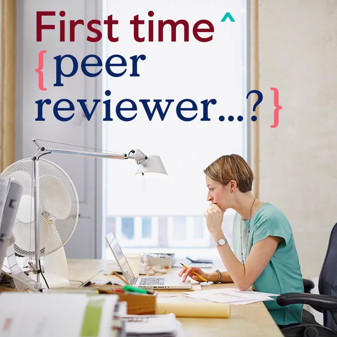 Individual reviewing documents at a desk with a computer, desk lamp, and fan, with text overlay reading 'First time peer reviewer...?' in a brightly lit office setting.