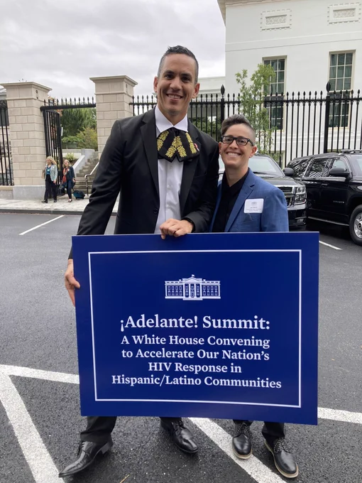 A picture of Director of White House Office of National AIDS Policy Francisco Ruiz and Building Healthy Online Communities’ Jen Hecht posing in front of a White House placard that reads: “Adelante Summit: A White House convening to accelerate our nation’s HIV response in Hispanic/Latino Communities.”