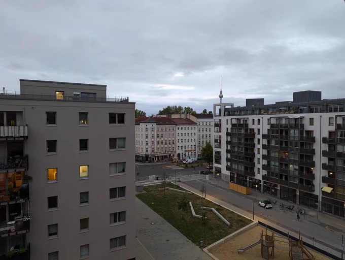 Sunrise from the Neue Mälzerei building with the Berlin TV tower near the horizon