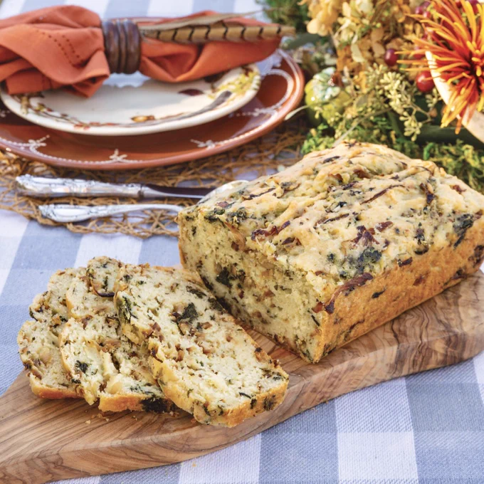 Third: Spinach, Onion, and Garlic Quick Bread sliced on a cutting board. 

