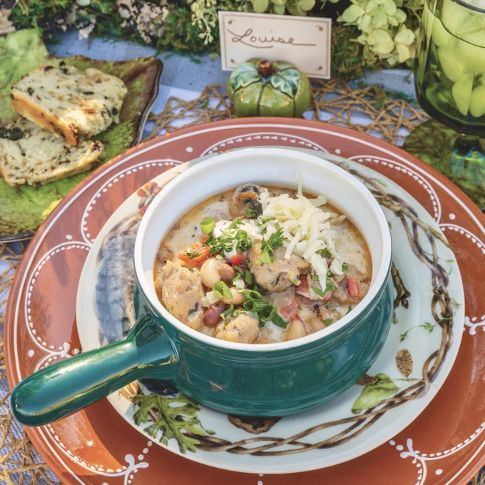 Fourth: Three-Bean Sausage Chili served in a bowl on a place setting. 