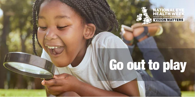 Image of a young girl smiling as she lies on the grass on a sunny day and looks at something through a magnifying glass. Overlayed on this are the words go out to play and the National Eye Health Week logo.
