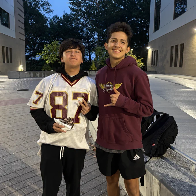 Two students posing and smiling