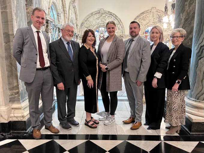 Pictured at the Community Relations in Schools ‘Buddy Up!’ celebration event in Belfast City Hall are: Bill Fletcher (Principal, Cliftonville IPS), Dr Norman Richardson (Stranmillis University College), Lisa Dietrich (CEO, CRIS), Junior Minister Aisling Reilly, Caoimhín Mac Uilliam (Principal, Scoil na Fuiseoige), Dawn Young (Principal, Ligoniel PS) and Bronagh McVeigh (Principal, St Vincent de Paul PS).