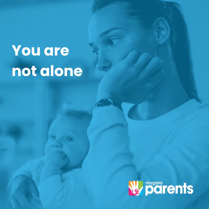 Mother staring off into the distance looking worried with her hand against her face. Baby is mirroring mother with hand on face and looking away.

Text: You are not alone (left top hand corner)