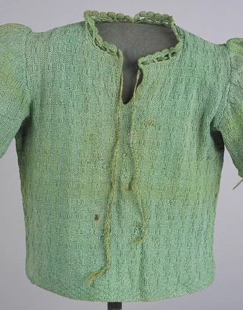 Image: at the Knitting History Forum conference in February 2025, Elizabeth Baer will discuss Krystyna Chiger’s green sweater, now at the United States Holocaust Memorial Museum in Washington DC