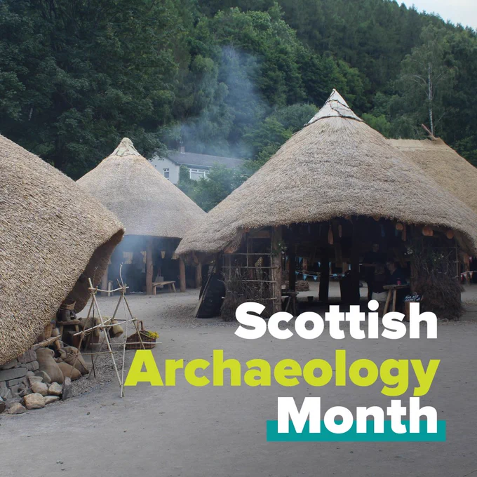 Wooden roundhouses with thatched roofs. Text overlain reads 'Scottish Archaeology month'