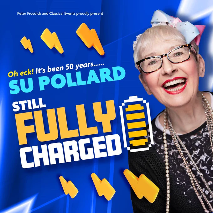 Su Pollard wearing glasses, a pale pink and blue bow in her hair and a black lace jumper with long necklaces against a blue background. Text reads proudly present. Oh eck! It's been fifty years... Su Pollard Still Fully Charged. Text is surrounded by plastic-looking lightening bolts and a full battery icon.