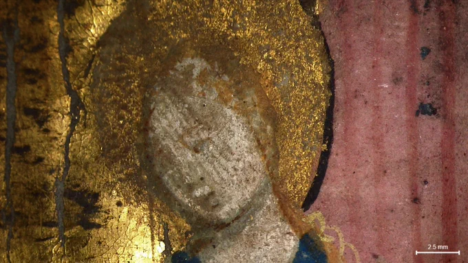 A 15th Century Book of Hours examined under a microscope at Cambridge University Library.