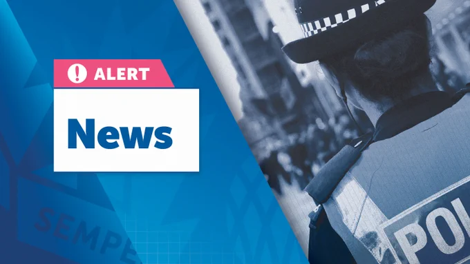 On the left side, there's a pink and white box with a warning icon and the word "ALERT" written in it. Below this, "News" is displayed in bold blue letters against a white background. The right side of the image features a blurred, blue-tinted photograph of a police officer from behind, wearing a uniform and hat."