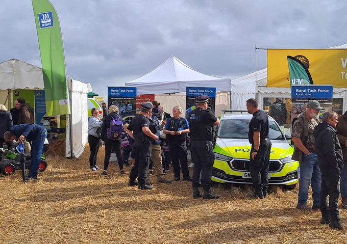 Police Officers speaking with the public at a community event. 