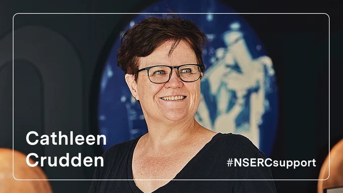 IMAGE: Closeup portrait of Cathleen Crudden (Queen’s University) with white text “Cathleen Crudden” on bottom left and “#NSERCsupport” on bottom right.