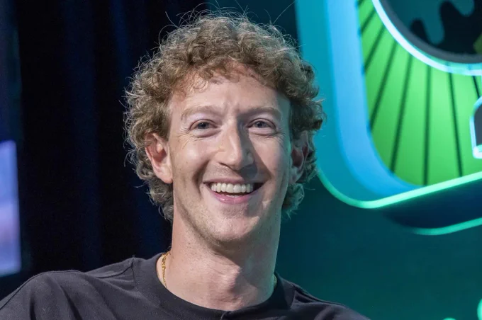 Mark Zuckerberg with medium length curly hair