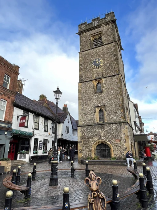 The mouse in front of the clock tower in St Albans.