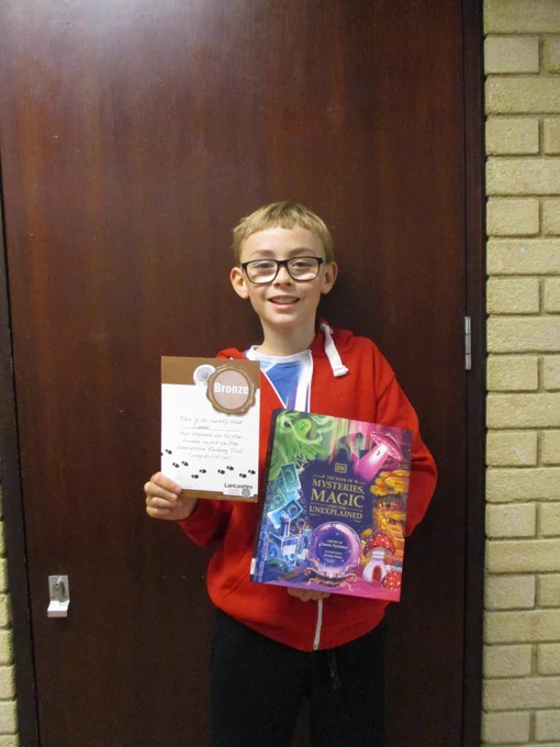 boy with certificate and book