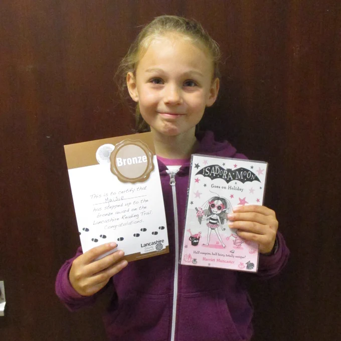 girl with certificate and book