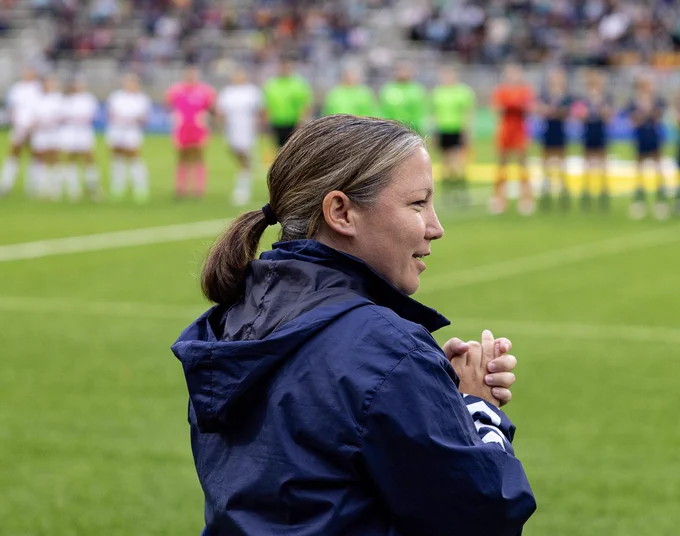 coach montgomery clapping at tco stadium 