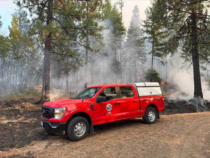 A Washington DNR wildfire truck sits on the edge of a prescribed burn in Chelan County.