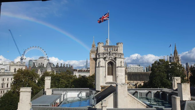 A rainbow over the London Eye and the Shard which end up hitting the tower in which Big Ben resides