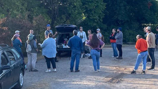 Scott Loss prepping a bunch of students for a morning of bird banding. 