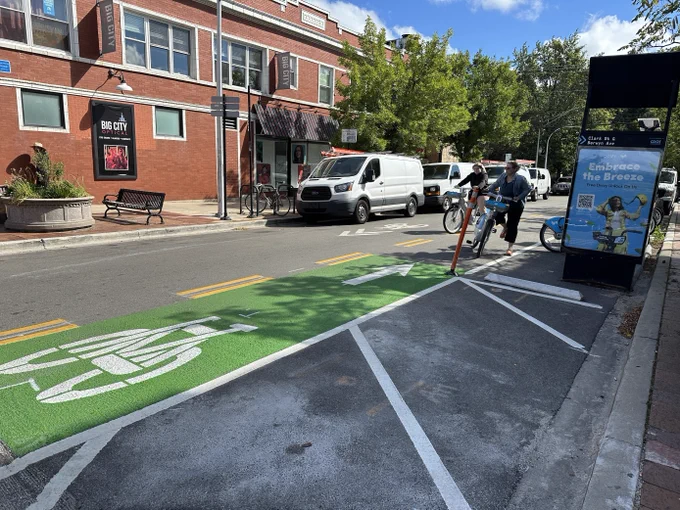 Two people renting Divvy bikes on the Berwyn greenway