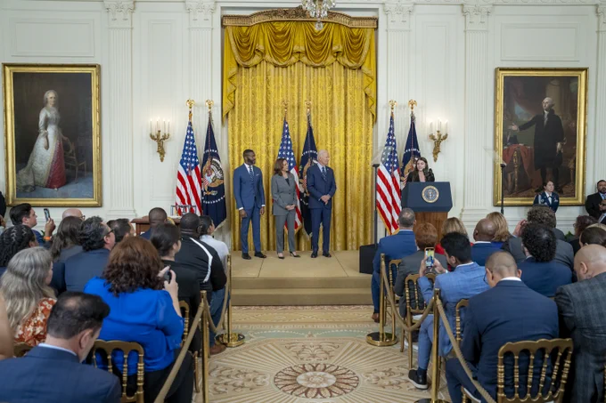 President Biden stands with Mayor Woodfin and Vice President Harris as Sari Kaufman, a Parkland survivor, speaks at the White House.