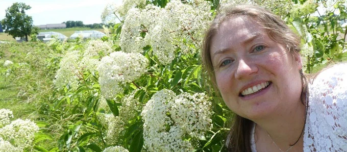 Photo of Senior Food Innovation Advisor Alice Jones with American elder flowers.