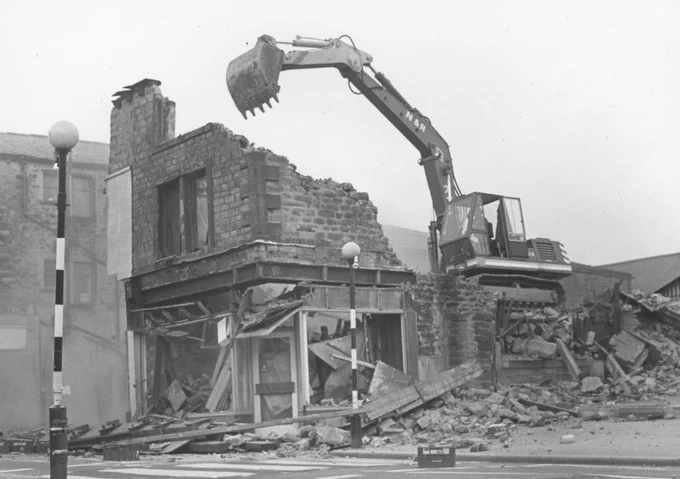 Black and white photo of Colne from the 1970s of a building being demolished