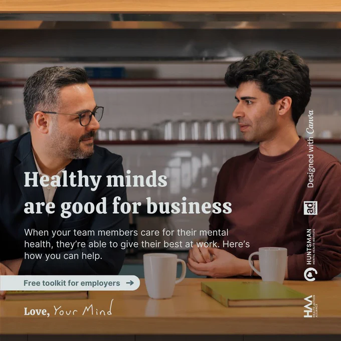 Promotional image for Love, Your Mind toolkit launch featuring two individuals conversing at a table in a restaurant. Includes text about the benefits of mental health care at work and an invitation to download the free toolkit for employers.
