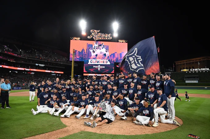 The Tigers pose for a team photo on the field at Comerica Park after clinching a postseason spot on Friday night. (Photo: Monica Bradburn/Major League Baseball)