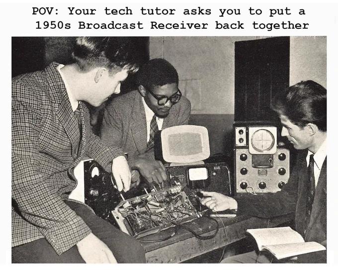 Three men working on a dismantled Broadcast Receiver