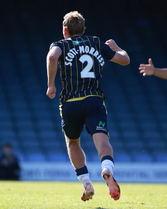 Gus Scott-Morriss celebrates after equalising.