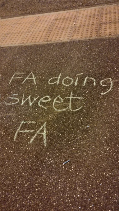 Street art that says FA doing sweet FA referring to men playing in women's leagues.
