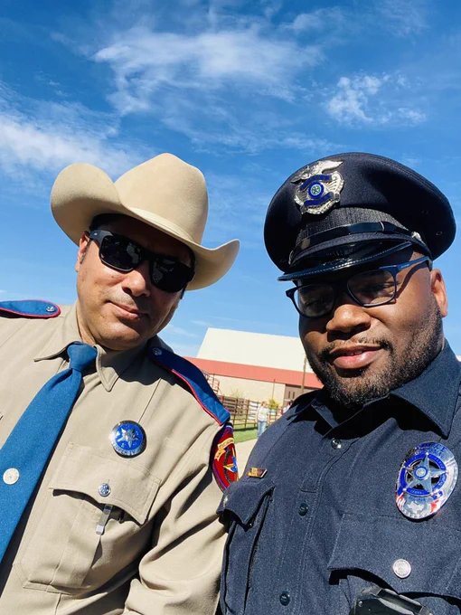 Cpl. Norwood is collaborating with a State Trooper at the State Fair Classic.