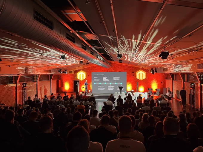 full conference room with Magento logo