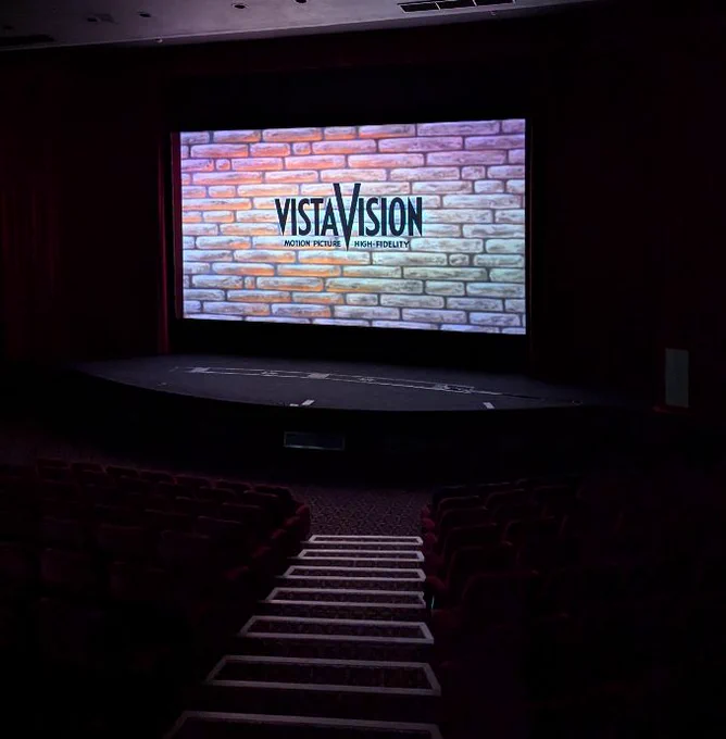 A cinema with the logo for VistaVision on the screen