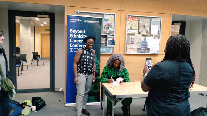 Anne-Marie signing books for attendees 