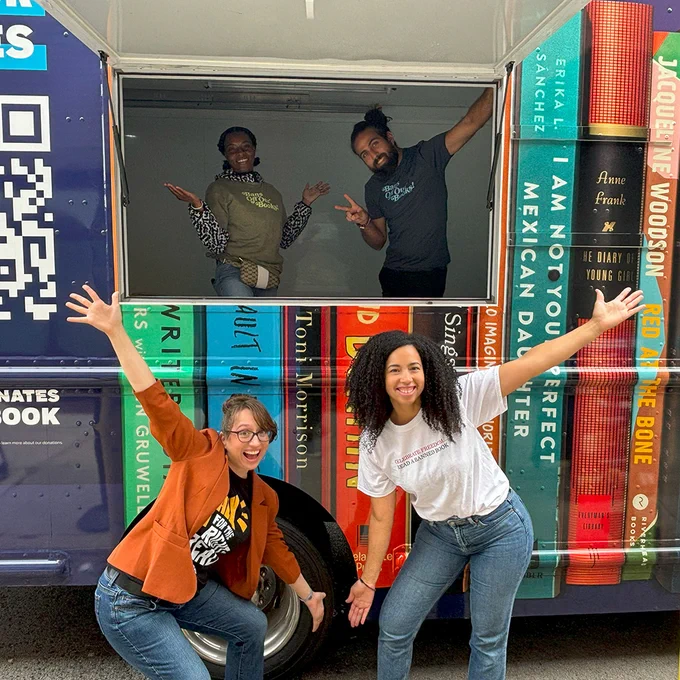 Volunteers manning the Banned Wagon ham it up for the camera as they prepare to distribute books.