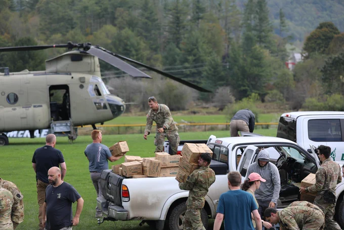 Soldiers assigned to the Connecticut, Maryland and North Carolina National Guard work together to distribute food and water to local first responders in Avery County on Sept 29, 2024. National Guard Aviation crews from Connecticut, Maryland, Pennsylvania and Iowa are supporting the NC Emergency Management and the NCNG in response to citizens affected by Helene. (U.S. Army National Guard photo by Sgt. 1st Class Leticia Samuels)