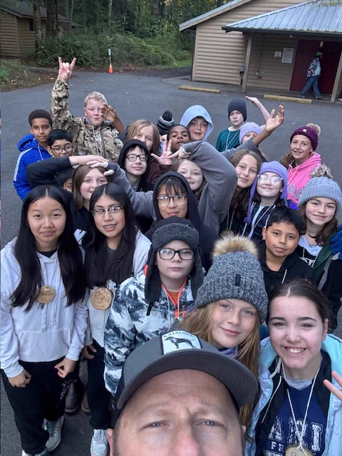 6th Graders & Teacher Mr. Hyman posing for a picture at Outdoor School.