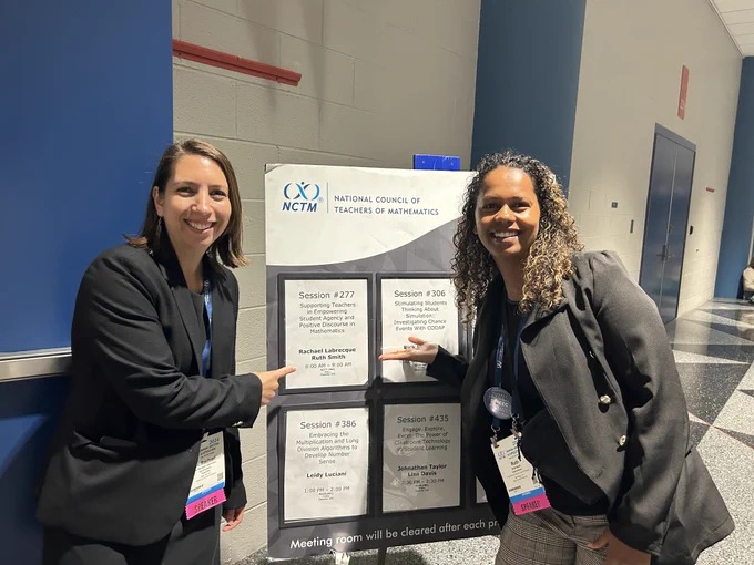 Dr. Rachael Labrecque of Teachley and Ruth Smith of High Tech High Graduate School of Education pointing to a poster showcasing their session titled, Supporting Teachers in Empowering Student Agency and Positive Discourse in Mathematics at NCTM 2024 Annual Meeting.