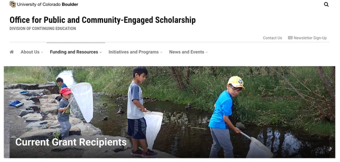 Screenshot of a University of Colorado Boulder webpage for the Office for Public and Community-Engaged Scholarship. Image shows kids with nets near a waterway.