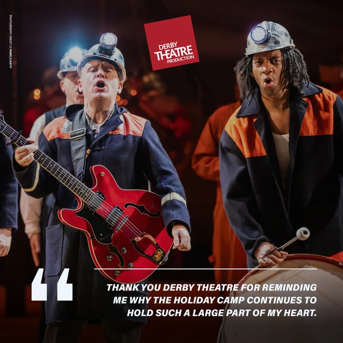 A stage scene from Derby Theatre's production. A man, dressed in a dark coat with orange stripes and wearing a miner's helmet with a headlamp, holds a red electric guitar and sings passionately. Next to him, another actor, also in a dark miner's coat with orange stripes, plays a drum with intensity. Both characters are engaged in an energetic performance. The Derby Theatre logo is prominently displayed at the top, and a quote below reads, "Thank you Derby Theatre for reminding me why the holiday camp continues to hold such a large part of my heart."