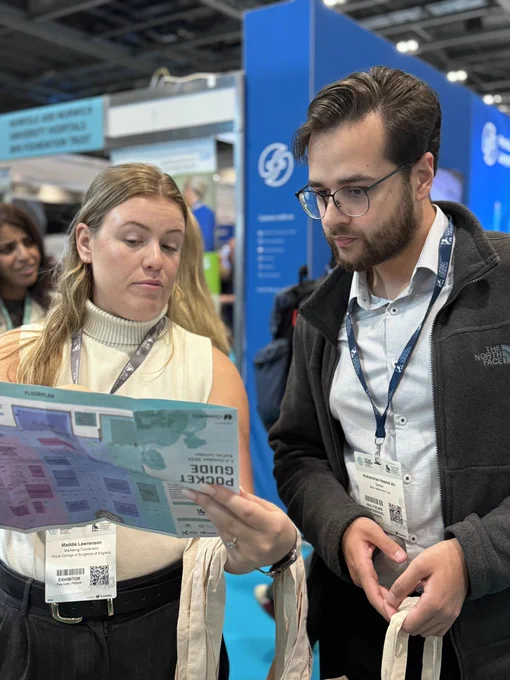 Two people look at a map at Future Surgery.