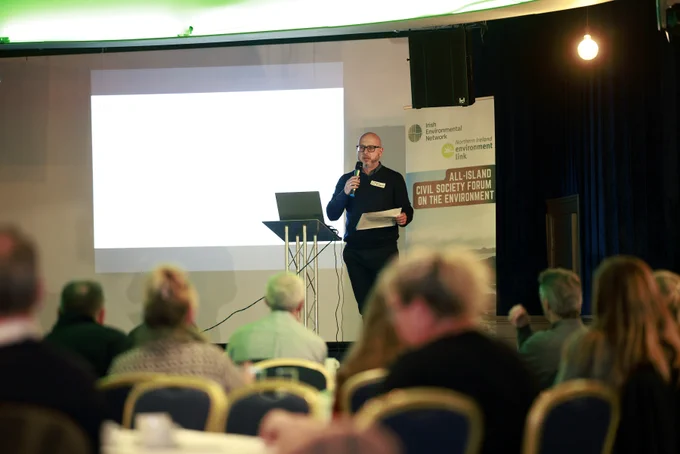 Photograph of Nigel speaking to the delegates.