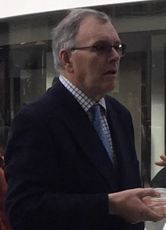 Red violin Festival Chairman Michael Beverley in Trinity Leeds