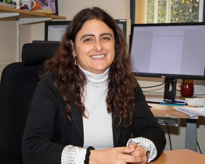 Photo of Sofia Villar, smiling and looking at camera.