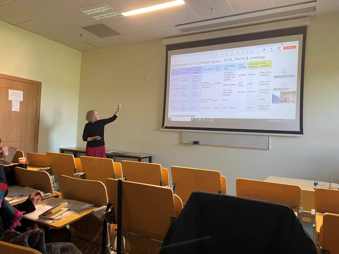 Rachel Murphy giving her presentation in front of a screen